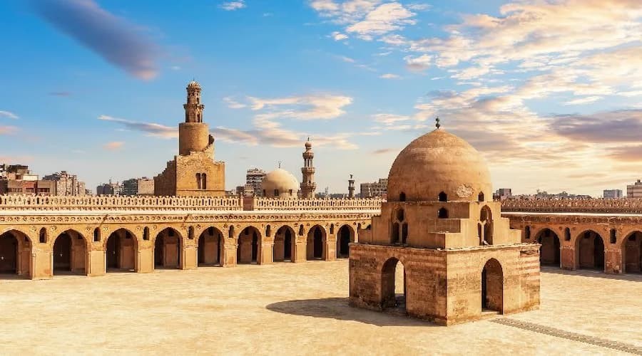 Exterior view of Ibn Tulun Mosque in Cairo showing its minaret and courtyard
